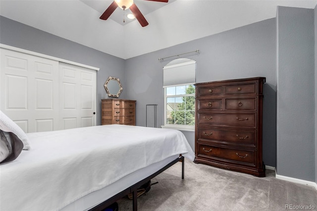 4712 Raven Run, Broomfield, CO 80023 - bedroom featuring light carpet, vaulted ceiling, baseboards, a ceiling fan, and a closet