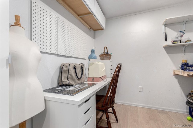 4712 Raven Run, Broomfield, CO 80023 - office space featuring baseboards, light wood finished floors, and built in desk
