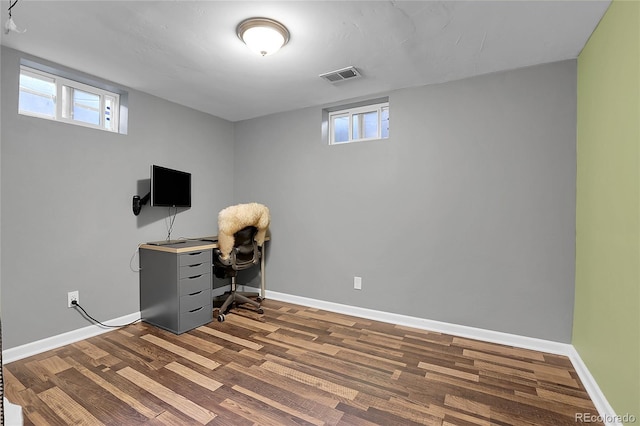 office featuring a wealth of natural light and hardwood / wood-style flooring