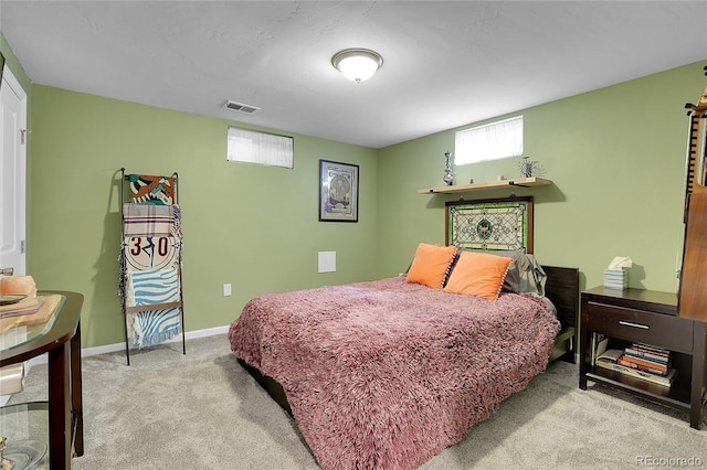 carpeted bedroom featuring multiple windows