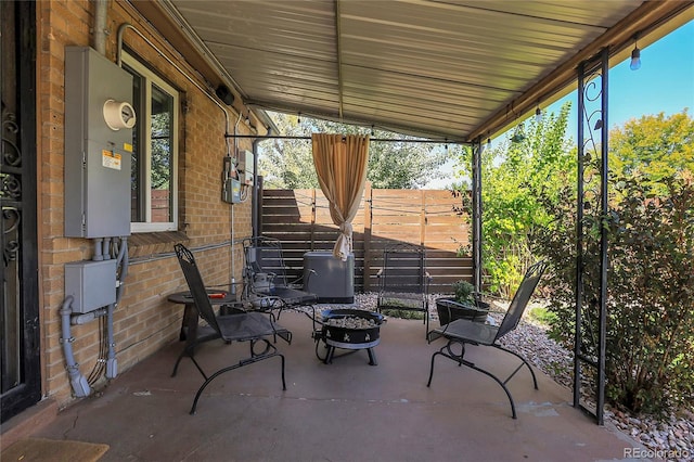 view of patio featuring an outdoor fire pit