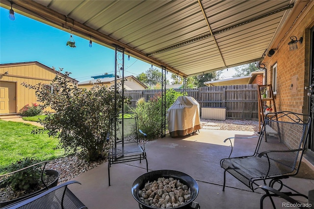 view of patio / terrace featuring an outdoor fire pit