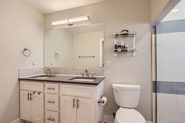 bathroom with toilet and vanity