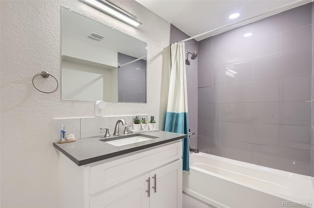 bathroom with vanity and shower / bathtub combination with curtain