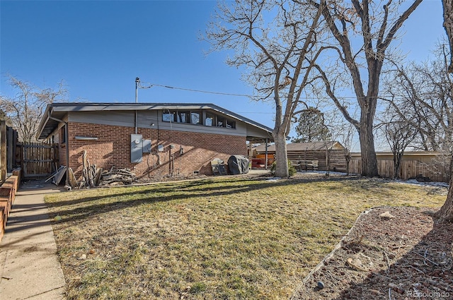 back of house with a lawn