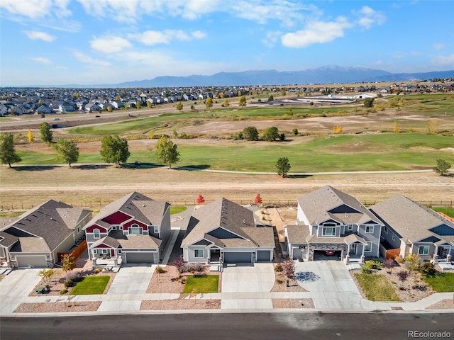 birds eye view of property featuring a mountain view