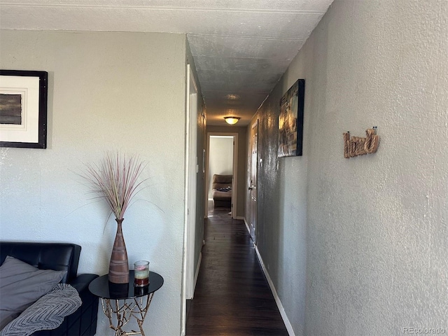 corridor featuring dark hardwood / wood-style flooring