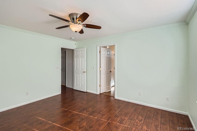 spare room with ceiling fan, ornamental molding, and dark wood-type flooring