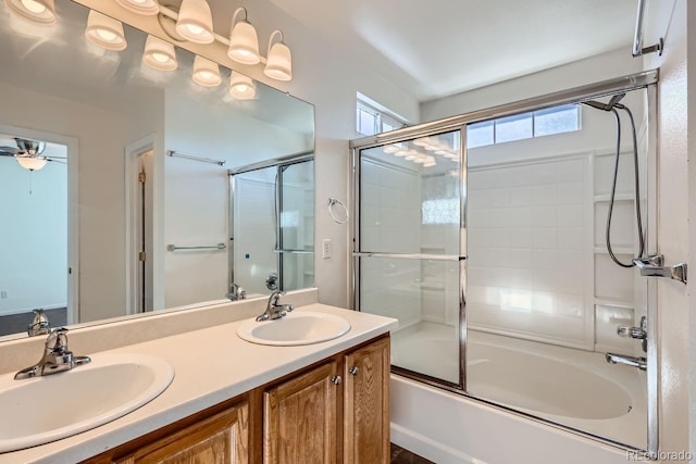 bathroom with vanity and shower / bath combination with glass door