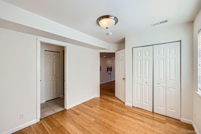 unfurnished bedroom with light hardwood / wood-style flooring