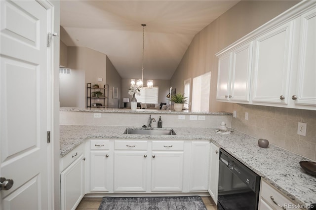 kitchen featuring black dishwasher, lofted ceiling, decorative backsplash, white cabinets, and a sink