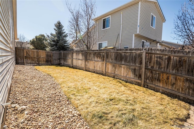 view of yard with a fenced backyard