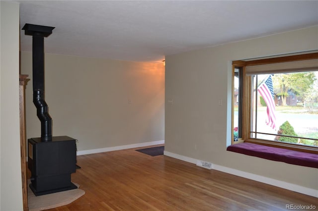 unfurnished living room featuring hardwood / wood-style floors