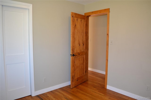 unfurnished room with light hardwood / wood-style floors