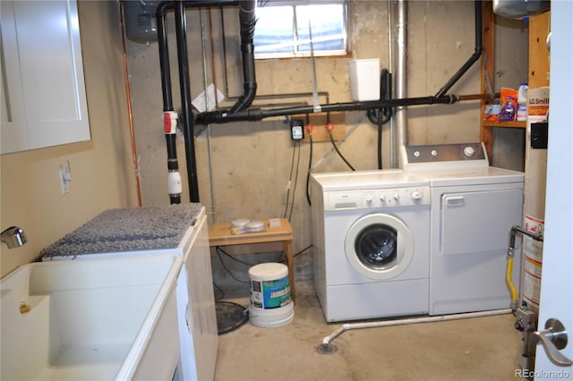 laundry room with independent washer and dryer and sink