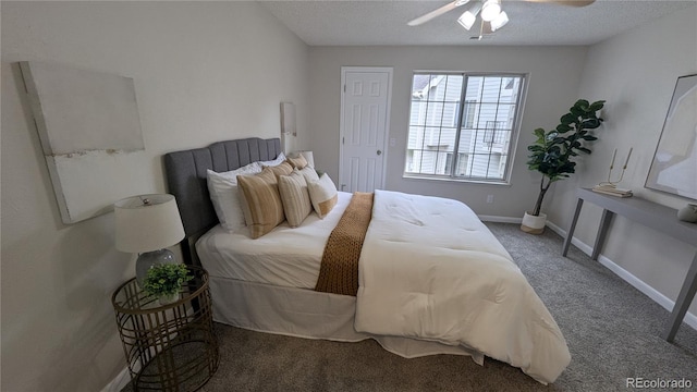13854 E Lehigh Ave Unit D, Aurora, CO 80014 - bedroom with carpet, ceiling fan, baseboards, and a textured ceiling