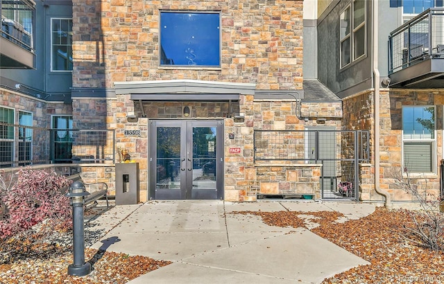 13598 Via Varra Unit 301, Broomfield, CO 80020 - property entrance with french doors and stone siding