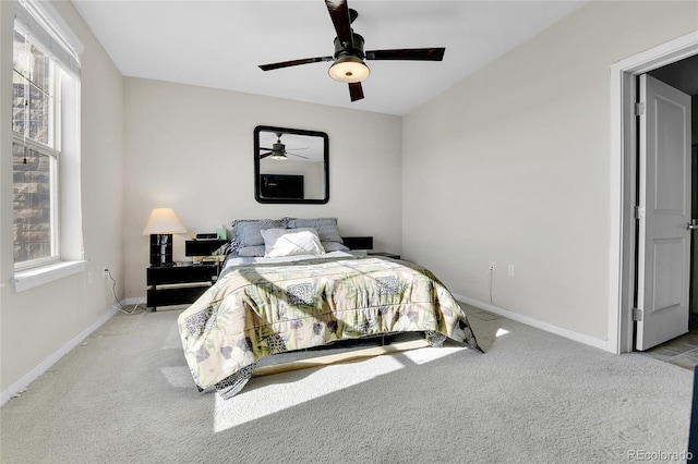 13598 Via Varra Unit 301, Broomfield, CO 80020 - bedroom featuring multiple windows, carpet floors, and ceiling fan