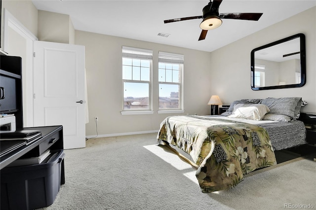 13598 Via Varra Unit 301, Broomfield, CO 80020 - carpeted bedroom with multiple windows and a ceiling fan