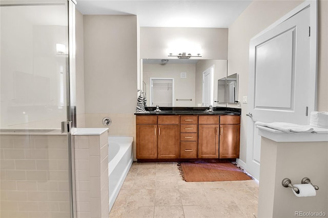 13598 Via Varra Unit 301, Broomfield, CO 80020 - full bathroom featuring double vanity, a garden tub, and a shower stall