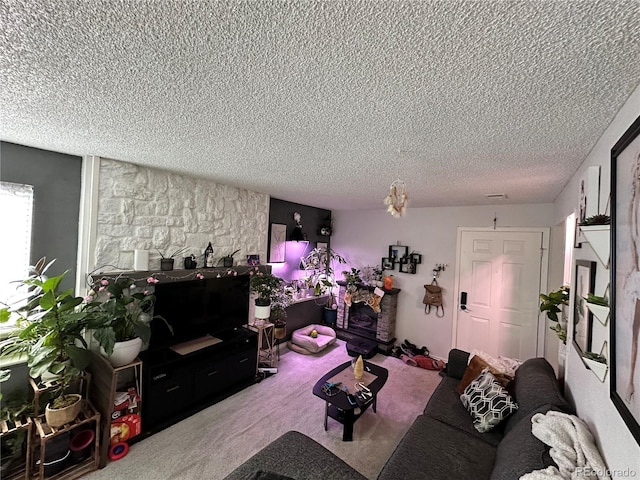 carpeted living room featuring a textured ceiling