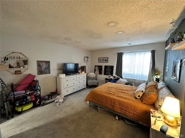 bedroom with carpet flooring and a textured ceiling