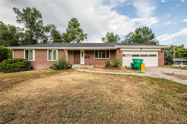 200 Garrison St, Lakewood, CO 80226 - ranch-style house with brick siding, driveway, and a front yard