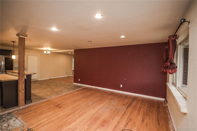 200 Garrison St, Lakewood, CO 80226 - unfurnished living room with wood finished floors and recessed lighting