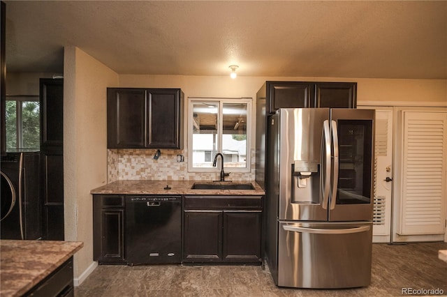 200 Garrison St, Lakewood, CO 80226 - kitchen with stainless steel fridge with ice dispenser, dishwasher, washer / clothes dryer, light stone counters, and decorative backsplash
