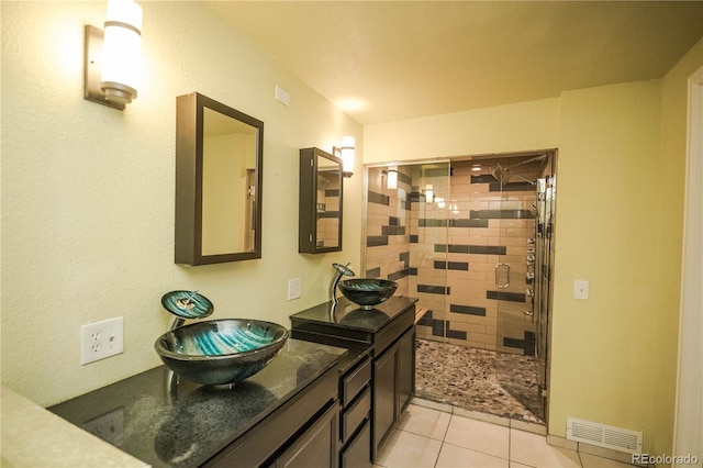 200 Garrison St, Lakewood, CO 80226 - bathroom with a shower stall, vanity, and tile patterned flooring