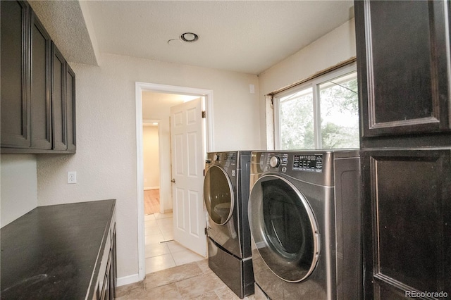 200 Garrison St, Lakewood, CO 80226 - washroom with cabinet space, independent washer and dryer, and light tile patterned flooring