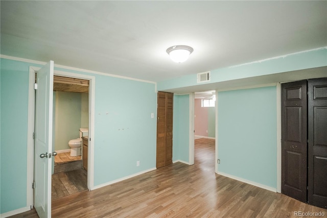 200 Garrison St, Lakewood, CO 80226 - unfurnished bedroom with light wood-style flooring and baseboards