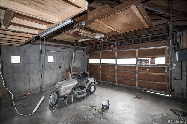 200 Garrison St, Lakewood, CO 80226 - garage with a garage door opener and concrete block wall