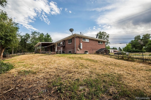 200 Garrison St, Lakewood, CO 80226 - back of property featuring brick siding and a sunroom