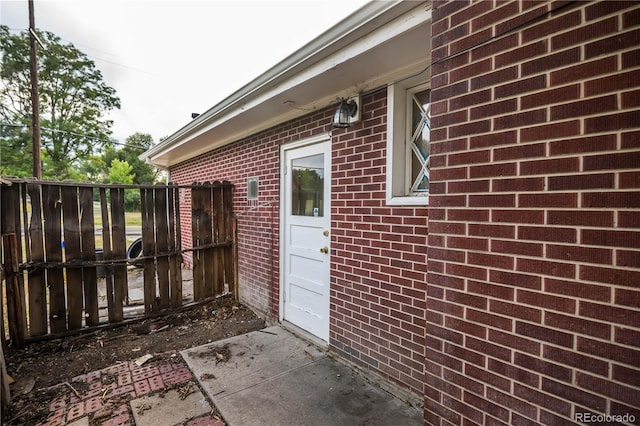 200 Garrison St, Lakewood, CO 80226 - doorway to property with brick siding and a garage