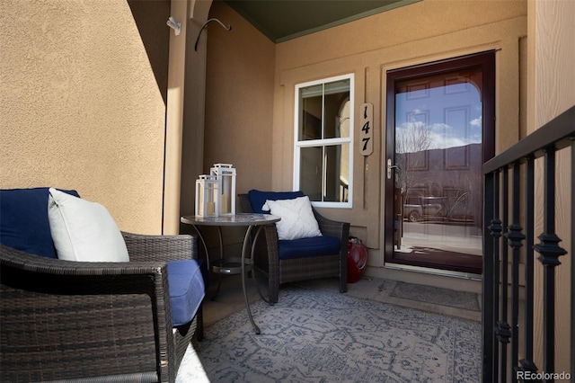 view of exterior entry with stucco siding