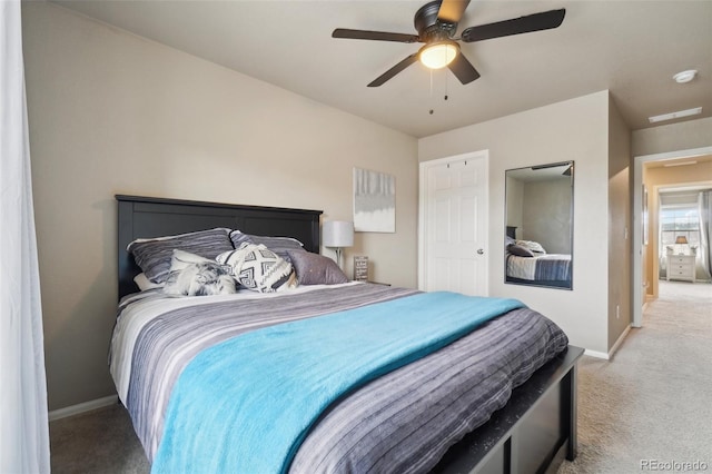 bedroom with baseboards, ceiling fan, and carpet flooring