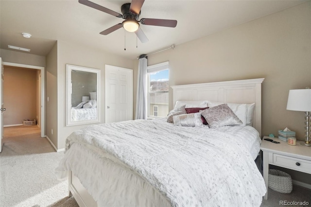 bedroom with baseboards, carpet floors, and ceiling fan