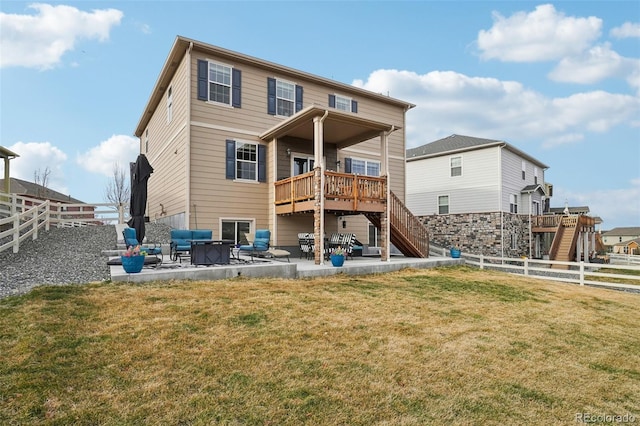 rear view of house featuring a fenced backyard, stairway, a lawn, and a patio