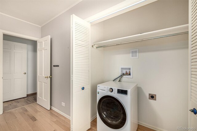 3756 S Forest Way, Denver, CO 80237 - clothes washing area featuring washer / clothes dryer, light wood-type flooring, ornamental molding, and baseboards