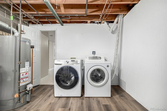 3756 S Forest Way, Denver, CO 80237 - washroom featuring water heater, washer and dryer, and wood finished floors