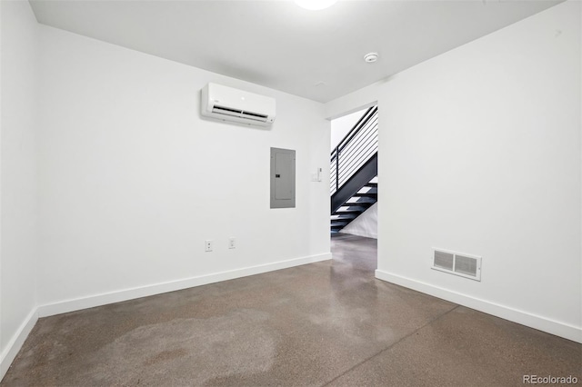 empty room with a wall mounted AC and electric panel