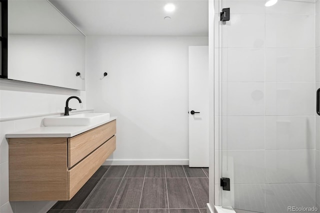 bathroom with vanity and an enclosed shower