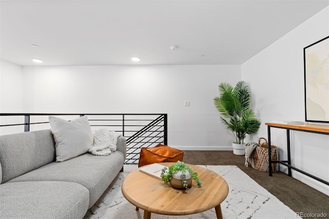 living room with dark carpet