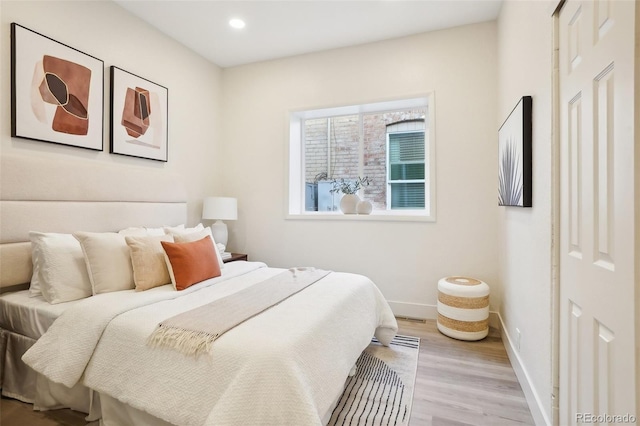 2121 W 33rd Ave, Denver, CO 80211 - bedroom with light wood-style flooring and recessed lighting
