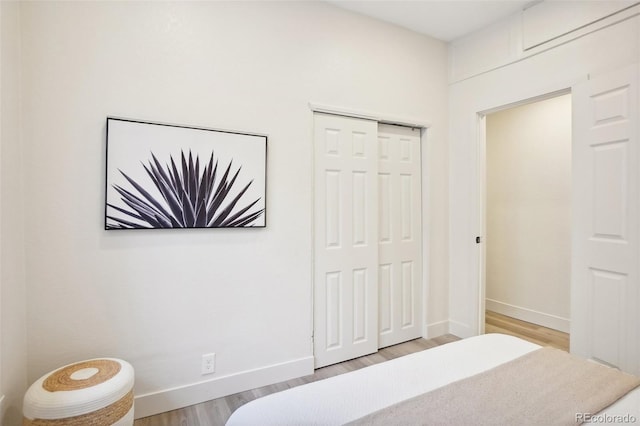 2121 W 33rd Ave, Denver, CO 80211 - bedroom featuring wood finished floors and a closet