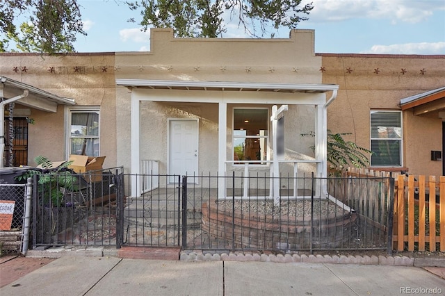 2121 W 33rd Ave, Denver, CO 80211 - entrance to property featuring stucco siding and a gate