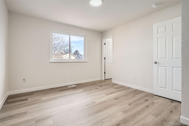 unfurnished room featuring light hardwood / wood-style flooring