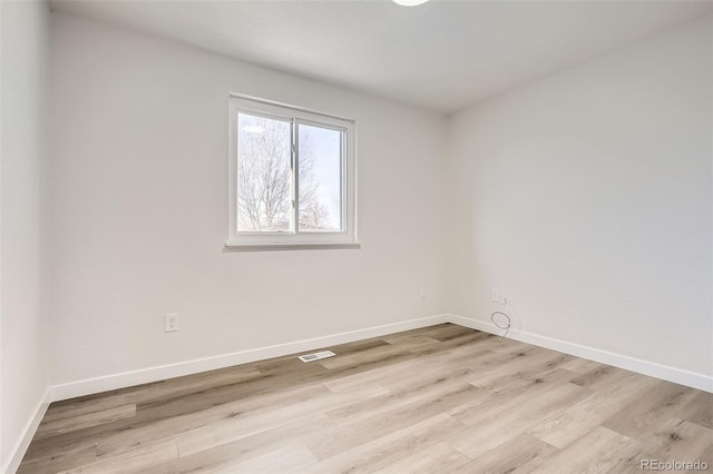 unfurnished room featuring light hardwood / wood-style flooring