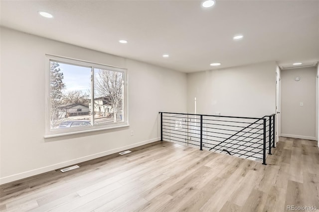 unfurnished room featuring light wood-type flooring